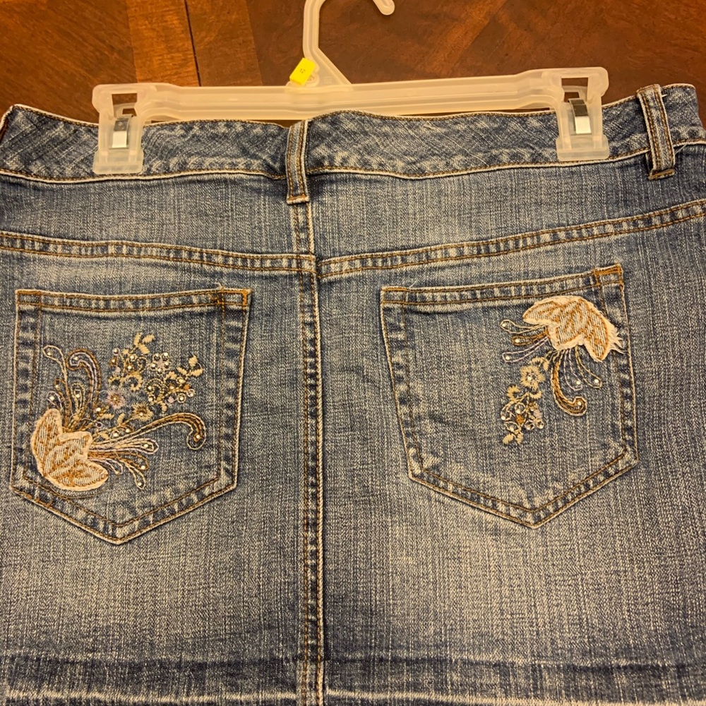 Blue jean skirt with sequin pockets distressed hem
